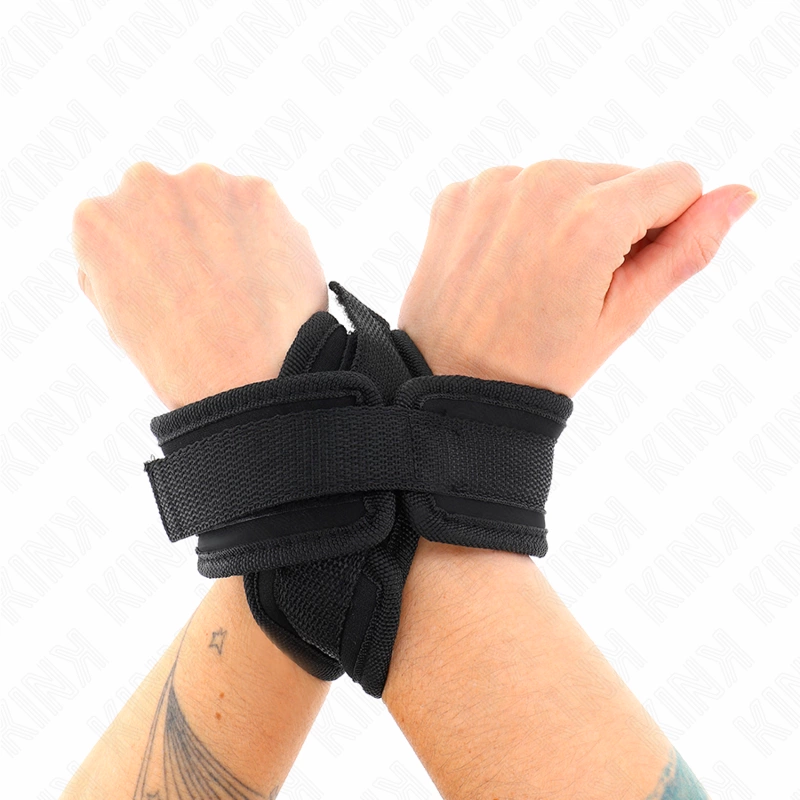 KINK Cross Cuffs Black 34x5,5 cm - Reguliuojama riešo atramos sistema